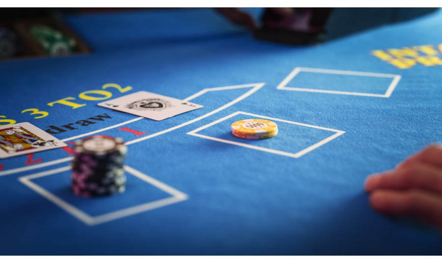 Baccarat Table close up with cards, chips and male hands