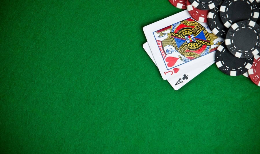 Black Jack Playing Cards on the corner of a table