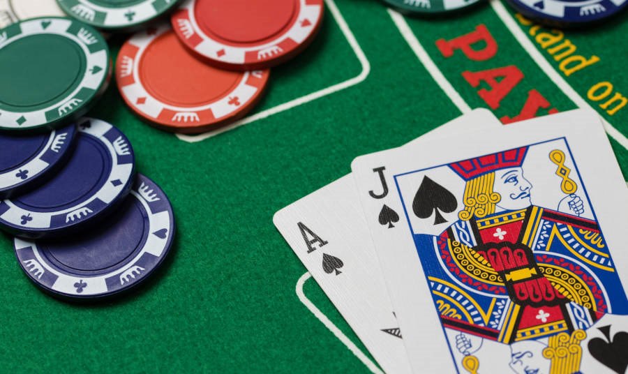 Two Cards and chips on a Blackjack table at a casino
