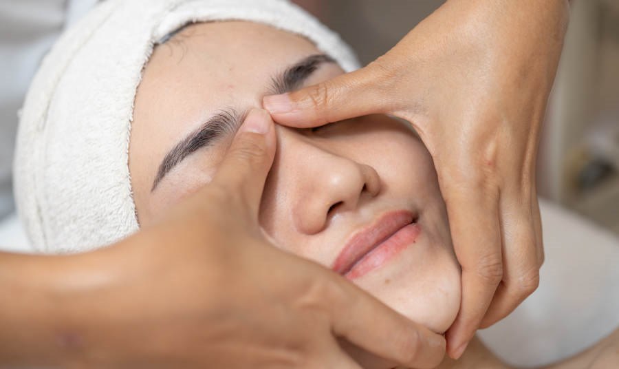 Closeup of a Women getting Facial Massage at a spa