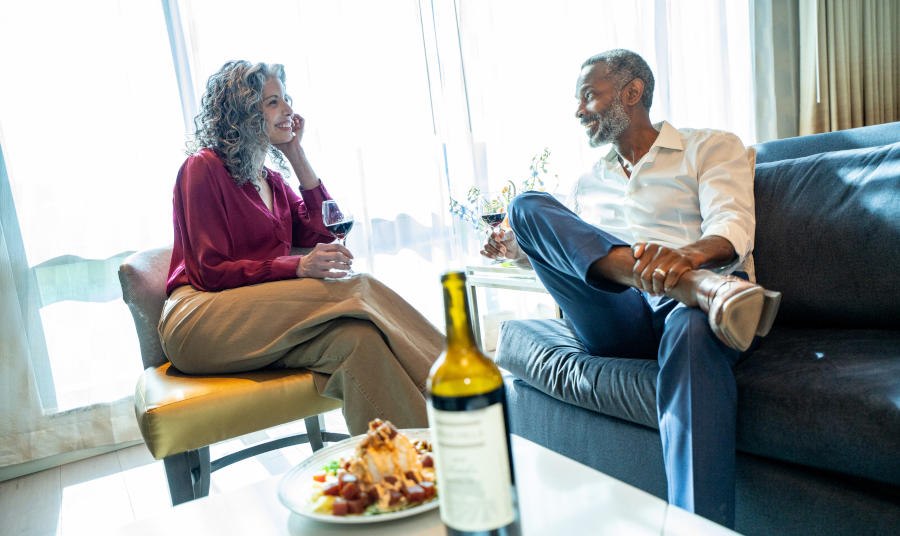 Couple enjoying wine in a Cache Creek hotel room