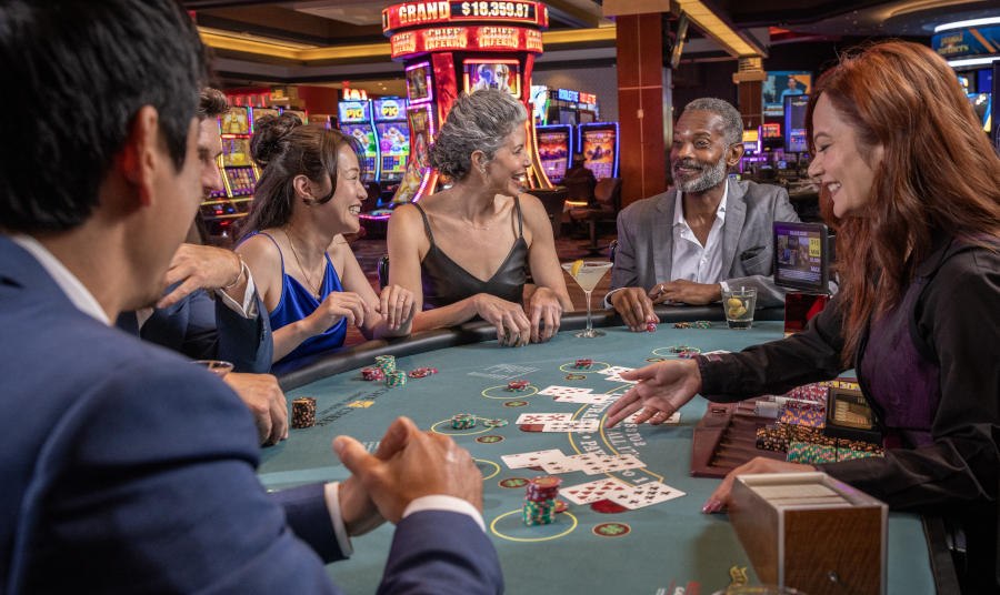 Group of people having fun playing blackjack at Cache Creek Casino