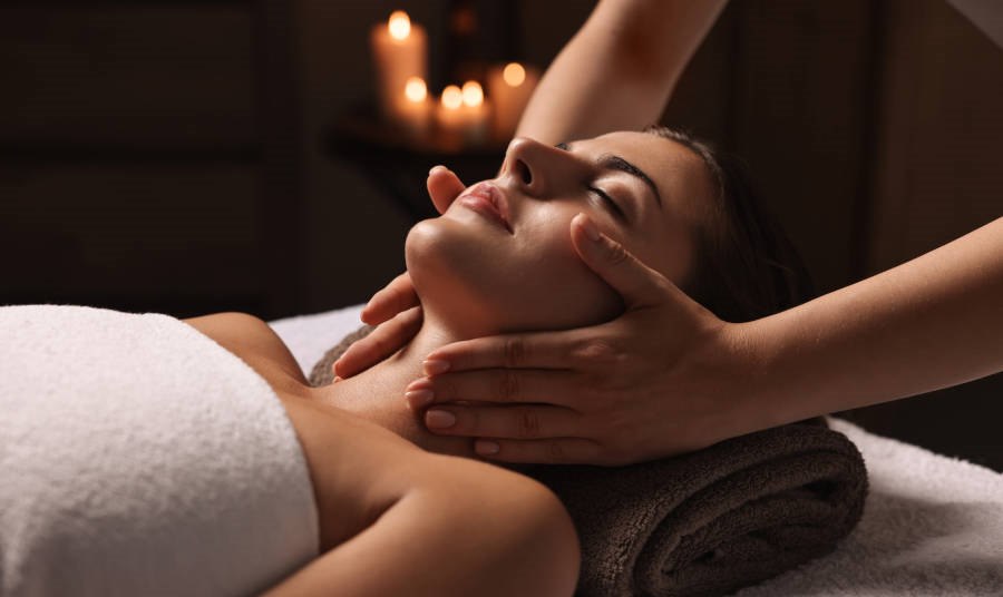Attractive woman enjoying face massage