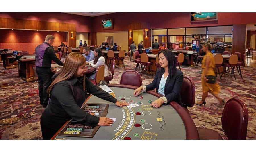 Women and Card Dealer at blackjack table in a Casino