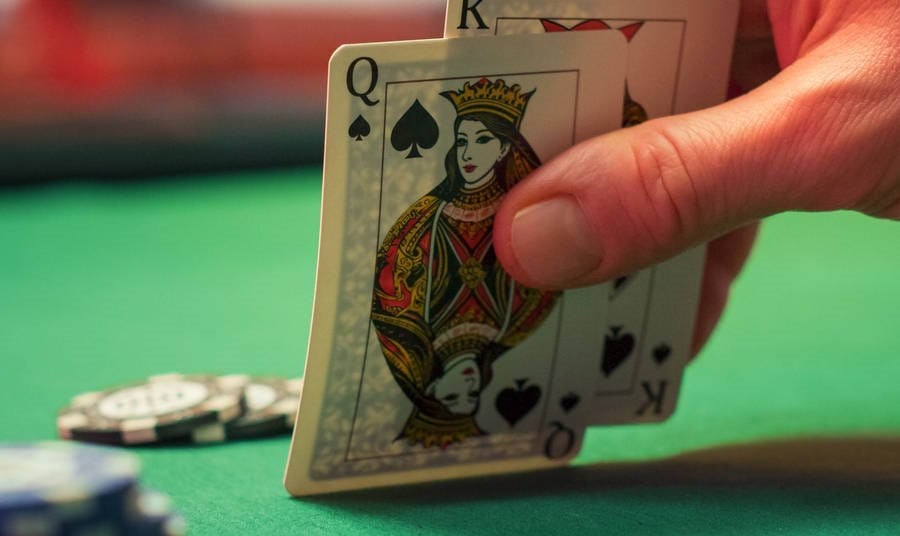 checking cards at a casino table