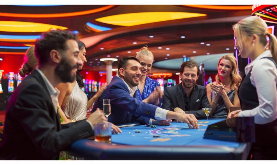 People around a blackjack table at a Casino