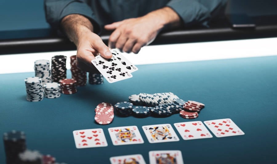 Man at a Texas Hold em table at a casino
